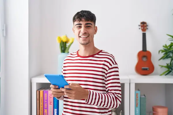 Young Hispanic Man Using Touchpad Standing Bedroom — Foto de Stock