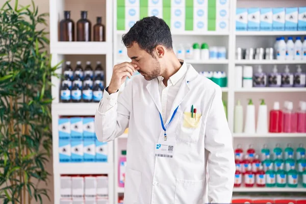 Handsome Hispanic Man Working Pharmacy Drugstore Tired Rubbing Nose Eyes — Stock Photo, Image