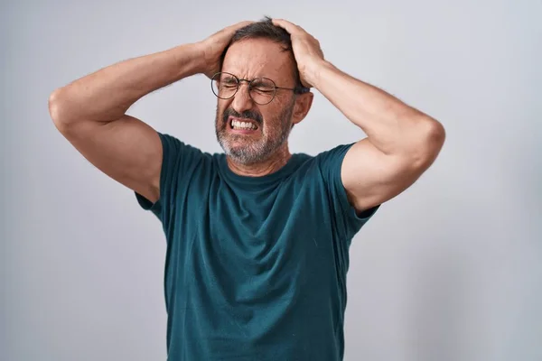 Middle age man stressed standing over isolated white background