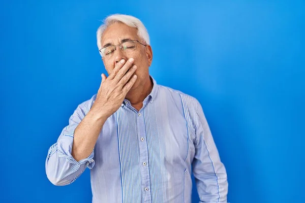 Hispanic Senior Man Wearing Glasses Bored Yawning Tired Covering Mouth — Stock Photo, Image