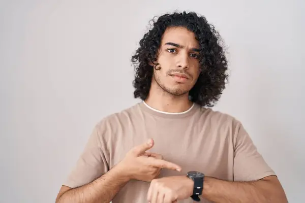 Hispanic Man Curly Hair Standing White Background Hurry Pointing Watch — Stock Photo, Image