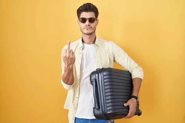 Young Hispanic Man Holding Suitcase Going Summer Vacation Showing Middle — Photo