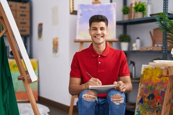 Young Hispanic Man Drawing Art Notebook Looking Positive Happy Standing — Stock Photo, Image