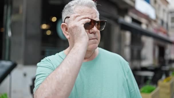 Middle Age Grey Haired Man Wearing Sunglasses Looking Side Serious — Stockvideo