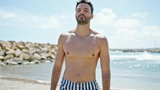 Young Hispanic Man Tourist Wearing Swimsuit Standing Beach — Stock Video