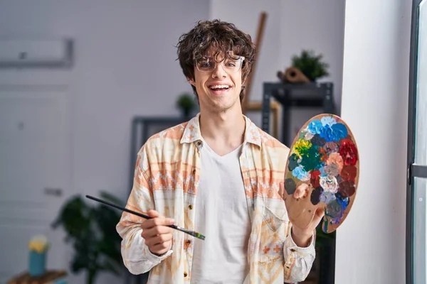 Young Hispanic Man Artist Holding Paintbrush Palette Art Studio — Stock Fotó