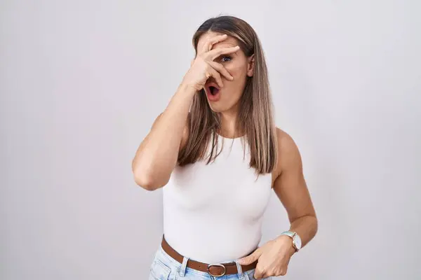 Hispanic Young Woman Standing White Background Peeking Shock Covering Face — Stock Photo, Image