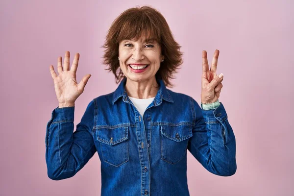 Middle Age Woman Standing Pink Background Showing Pointing Fingers Number — Stock Photo, Image