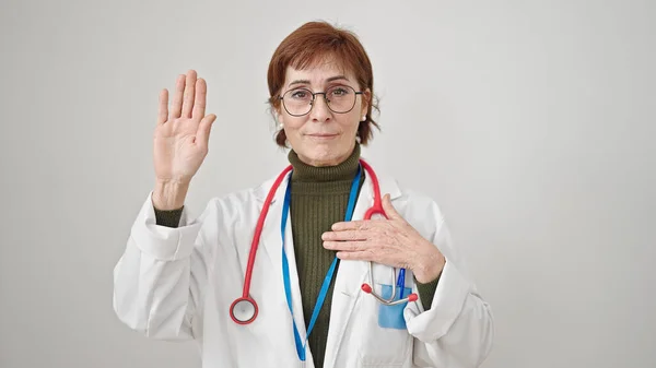 Mature Hispanic Woman Doctor Making Oath Hand Chest Isolated White — Stock Photo, Image