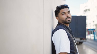 African american man standing with serious expression at street