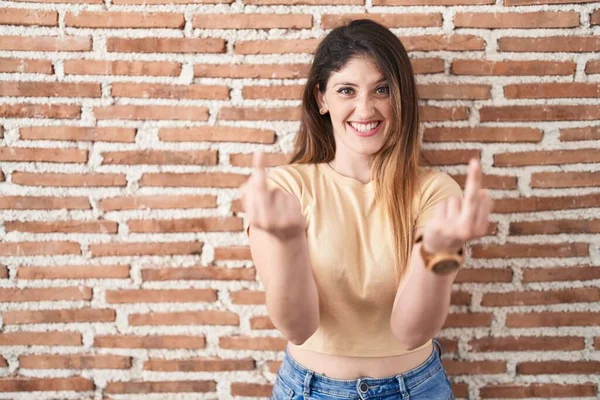 Young Brunette Woman Standing Bricks Wall Showing Middle Finger Doing — kuvapankkivalokuva