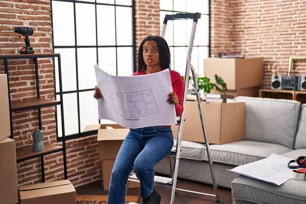 Young African American Braids Standing New Home Looking Blueprints Making — Stock Photo, Image