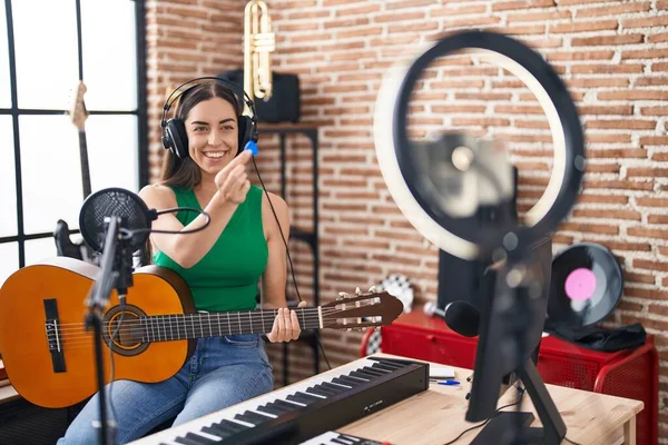 Young Hispanic Woman Musician Recording Classical Guitar Lesson Smartphone Music — Zdjęcie stockowe