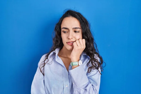Young Brunette Woman Standing Blue Background Looking Stressed Nervous Hands — Stock Photo, Image