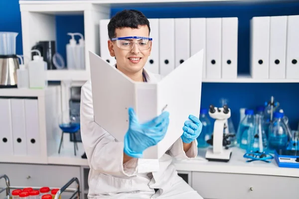 Young Non Binary Man Scientist Smiling Confident Reading Document Laboratory — Stock Photo, Image
