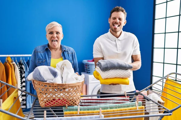 Hispanic Mother Son Hanging Clothes Clothesline Sticking Tongue Out Happy — Stock Photo, Image
