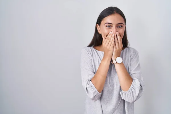 Young Hispanic Woman Standing White Background Laughing Embarrassed Giggle Covering — Foto Stock