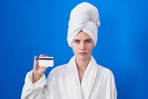 Blonde Caucasian Woman Wearing Bathrobe Holding Credit Card Thinking Attitude — Stock Photo, Image