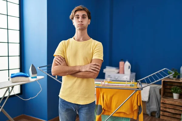 Young Man Doing Laundry Puffing Cheeks Funny Face Mouth Inflated — Stock Photo, Image