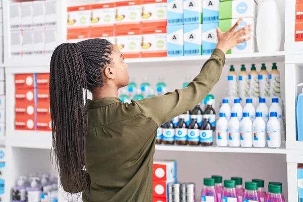 African American Woman Customer Holding Medicine Bottle Shelving Pharmacy — Stockfoto