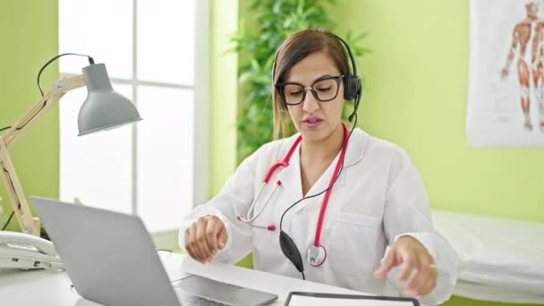Middle Eastern Woman Doctor Video Call Reading Clipboard Clinic — Stock Video