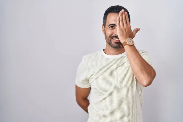 Hispanic Man Beard Standing Isolated Background Covering One Eye Hand — Foto Stock
