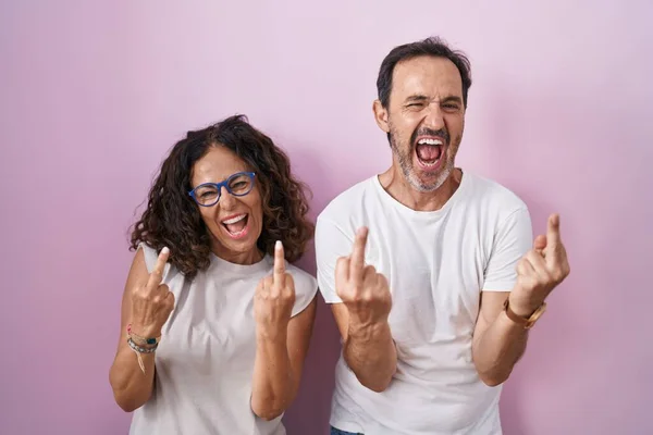 Middle Age Hispanic Couple Together Pink Background Showing Middle Finger — Photo