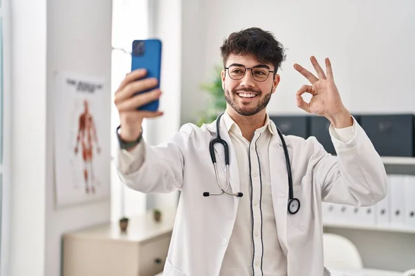 Hispanic Man Beard Working Online Appointment Doing Sign Fingers Smiling — Stock Photo, Image