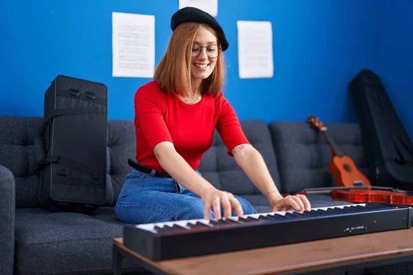 Young Redhead Woman Musician Smiling Confident Playing Piano Music Studio — Foto Stock
