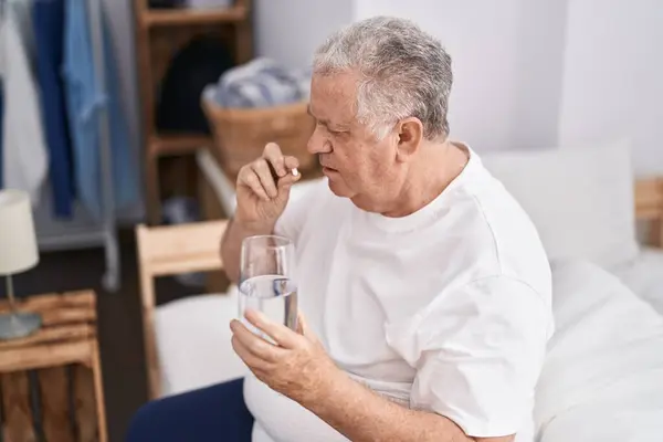 Middle Age Grey Haired Man Taking Pill Drinking Water Sitting — Stock Photo, Image
