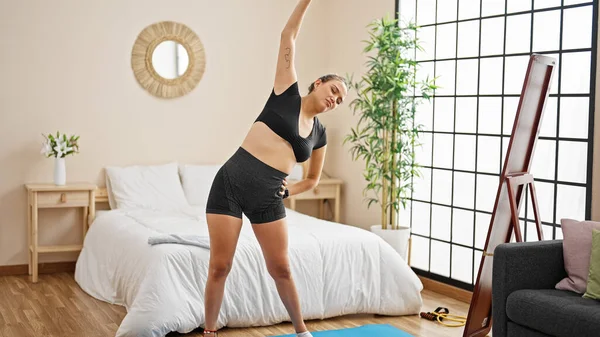 Young Beautiful Hispanic Woman Wearing Sportswear Stretching Back Bedroom — Stock Photo, Image