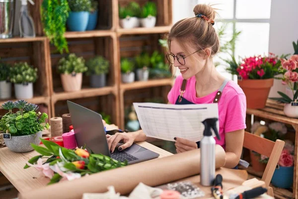 Young Blonde Woman Florist Using Laptop Reading Document Flower Shop — 图库照片
