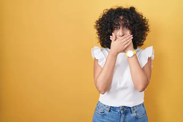 Young Middle East Woman Standing Yellow Background Shocked Covering Mouth — Stock Photo, Image