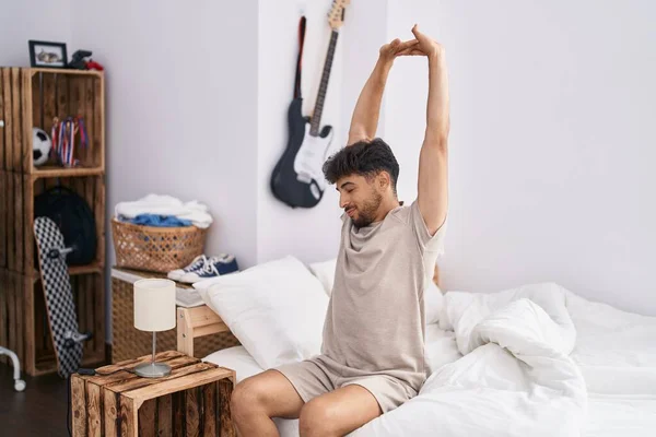 Young Arab Man Waking Stretching Arms Bedroom — Foto de Stock
