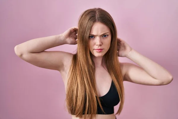 Young Caucasian Woman Wearing Lingerie Pink Background Skeptic Nervous Frowning — Fotografia de Stock