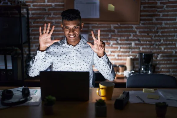 Young Hispanic Man Working Office Night Showing Pointing Fingers Number — Stock Photo, Image