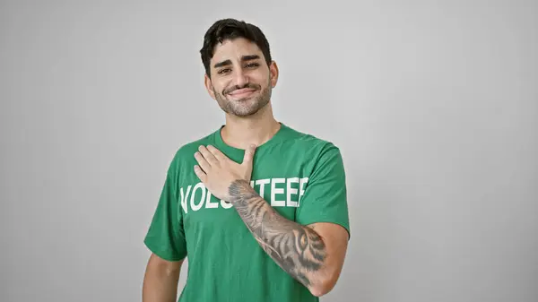Young Hispanic Man Volunteer Smiling Confident Touching Chest Isolated White — Stock Photo, Image