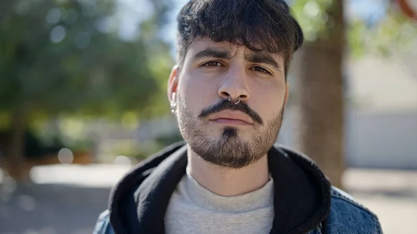 Young Hispanic Man Standing Serious Expression Park — Fotografia de Stock