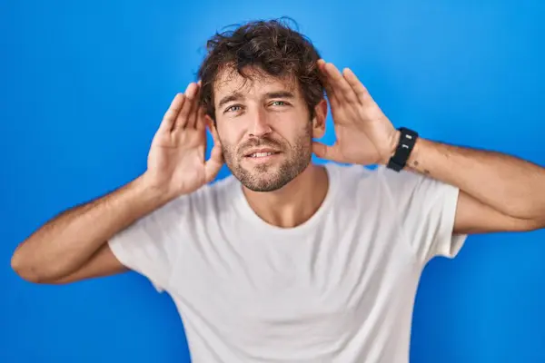 Hispanic Young Man Standing Blue Background Trying Hear Both Hands — 图库照片