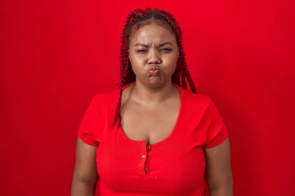 African American Woman Braided Hair Standing Red Background Puffing Cheeks — Stock Photo, Image
