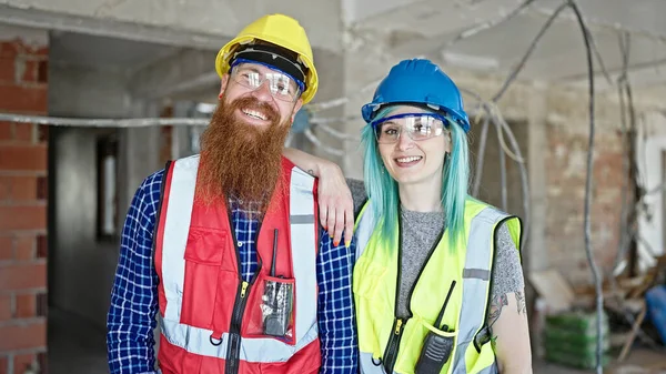 Man Woman Builders Smiling Confident Standing Together Construction Site — Stock Photo, Image