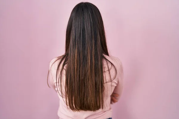 Young Brunette Woman Standing Pink Background Standing Backwards Looking Away — 스톡 사진