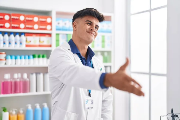 Young Hispanic Man Pharmacist Smiling Confident Shake Hand Pharmacy — Stock Photo, Image