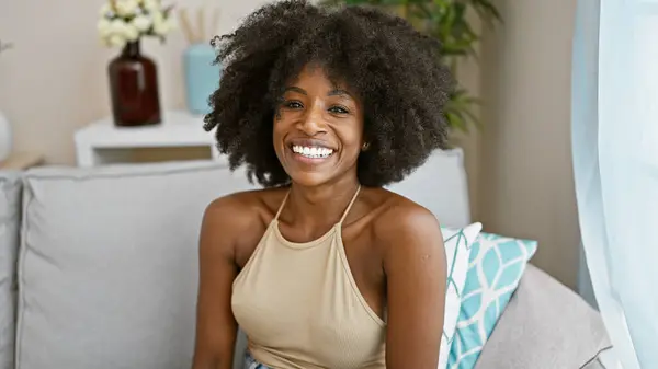 African American Woman Smiling Confident Sitting Sofa Home — Zdjęcie stockowe