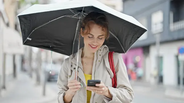 Young Woman Holding Umbrella Using Smartphone Smiling Street — Stock Photo, Image