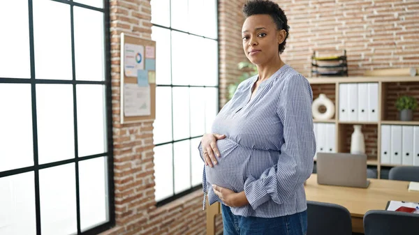 Young Pregnant Woman Business Worker Touching Belly Serious Expression Office — Stock Photo, Image