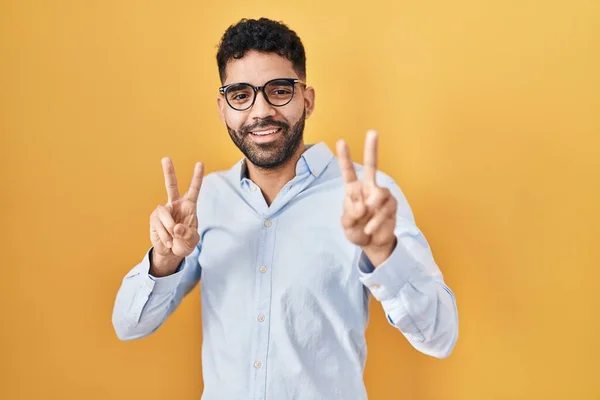 Hispanic Man Beard Standing Yellow Background Smiling Looking Camera Showing — 스톡 사진