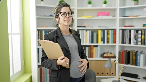 Young Pregnant Woman Teacher Holding Clipboard Touching Belly Library University — Stock Photo, Image