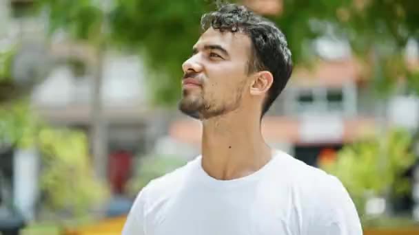 Young Hispanic Man Sneezing Park — Stock Video