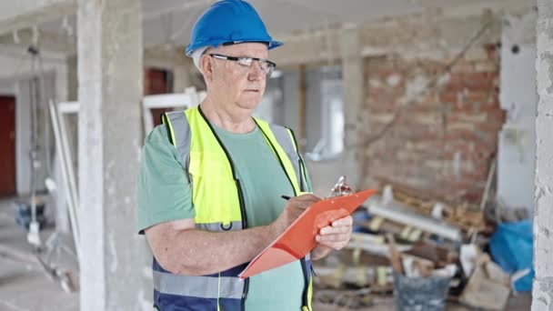 Middle Age Grey Haired Man Builder Smiling Confident Writing Clipboard — Stock Video
